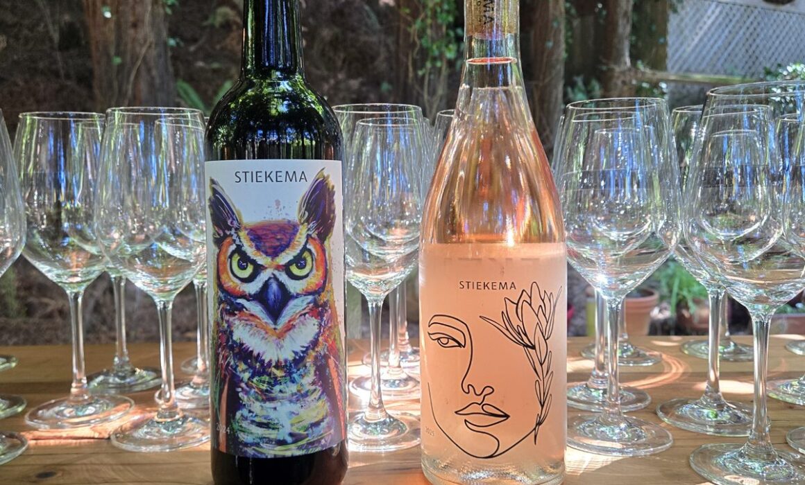 Stiekema owl label red wine and rosé bottles on an outdoor tasting bar